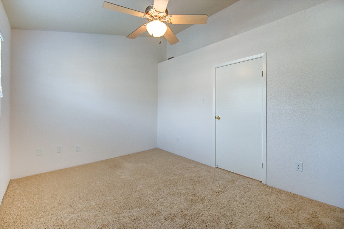 2002 Gentryside Drive, Unit 117 Houston, TX 77077 - Photo 23 of 31 an empty room with a fan & a fan