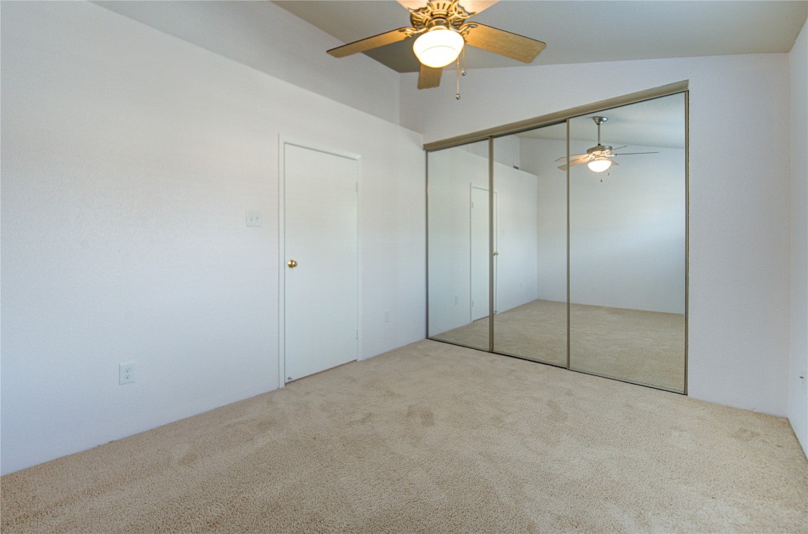 2002 Gentryside Drive, Unit 117 Houston, TX 77077 - Photo 24 of 31 an empty room with fan and glass door
