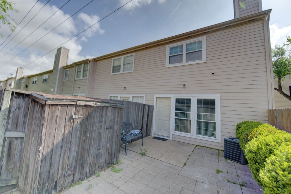 2002 Gentryside Drive, Unit 117 Houston, TX 77077 - Photo 28 of 31 a view of a house with a backyard and porch