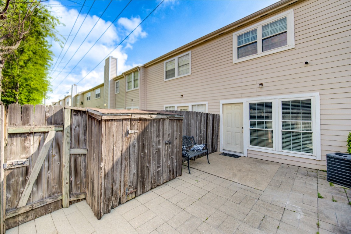 2002 Gentryside Drive, Unit 117 Houston, TX 77077 - Photo 29 of 31 a view of a house with wooden fence