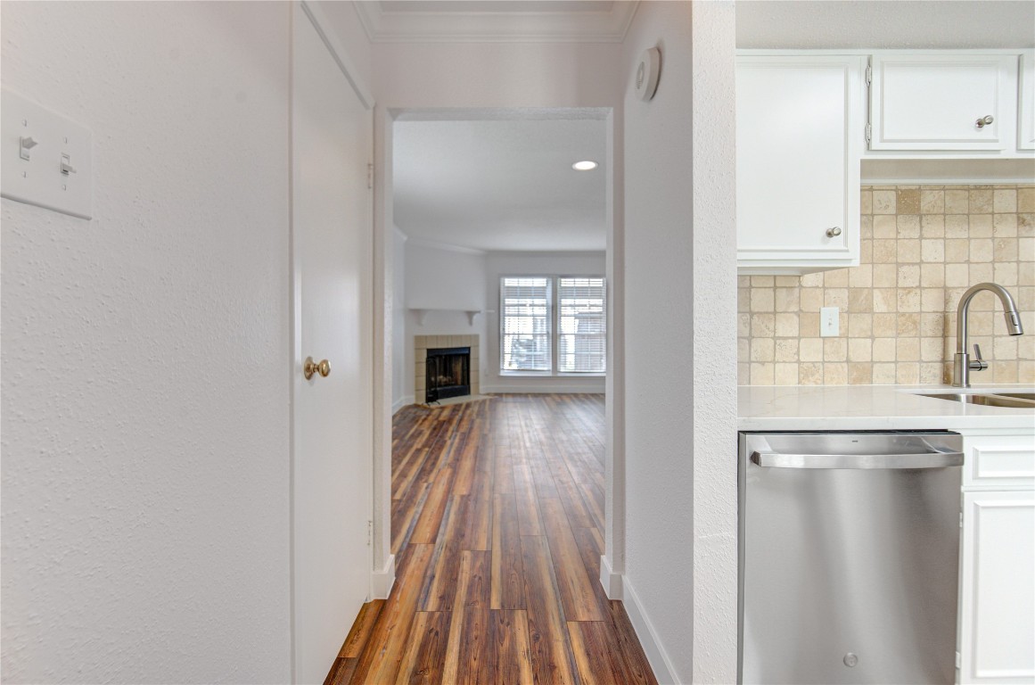 2002 Gentryside Drive, Unit 117 Houston, TX 77077 - Photo 8 of 31 a view of a kitchen from the hallway with a sink