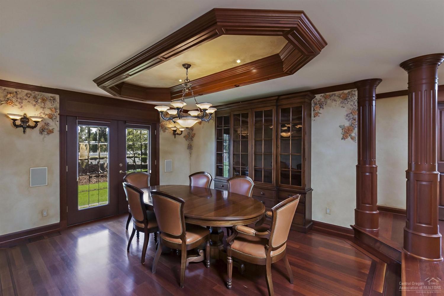 65131 Highland Road Bend, OR 97703 - Photo 9 of 22 a view of a dining room with furniture window and wooden floor