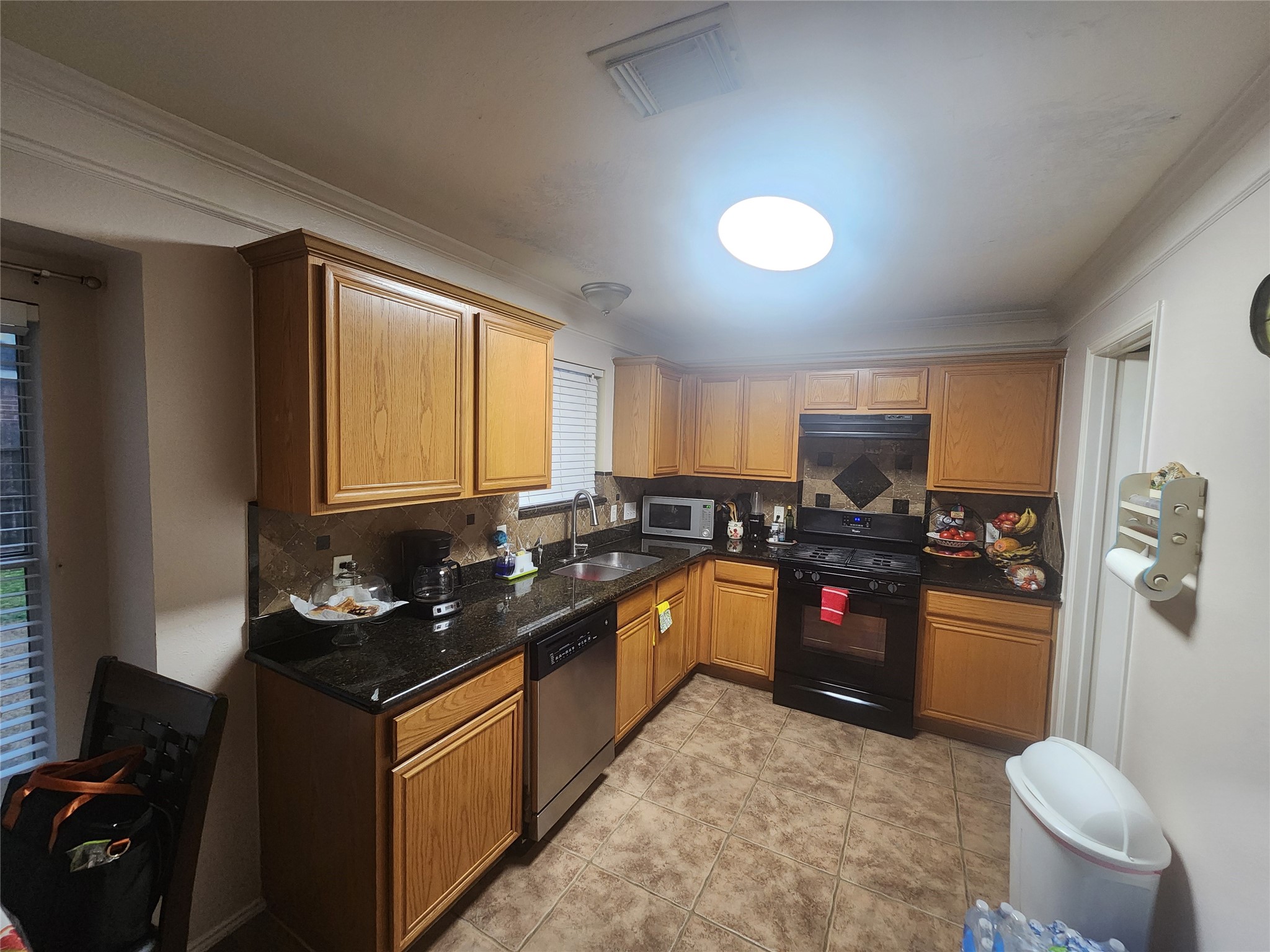 1530 Cartwright Road Missouri City, TX 77489 - Photo 20 of 23 a kitchen with granite countertop lots of counter top space