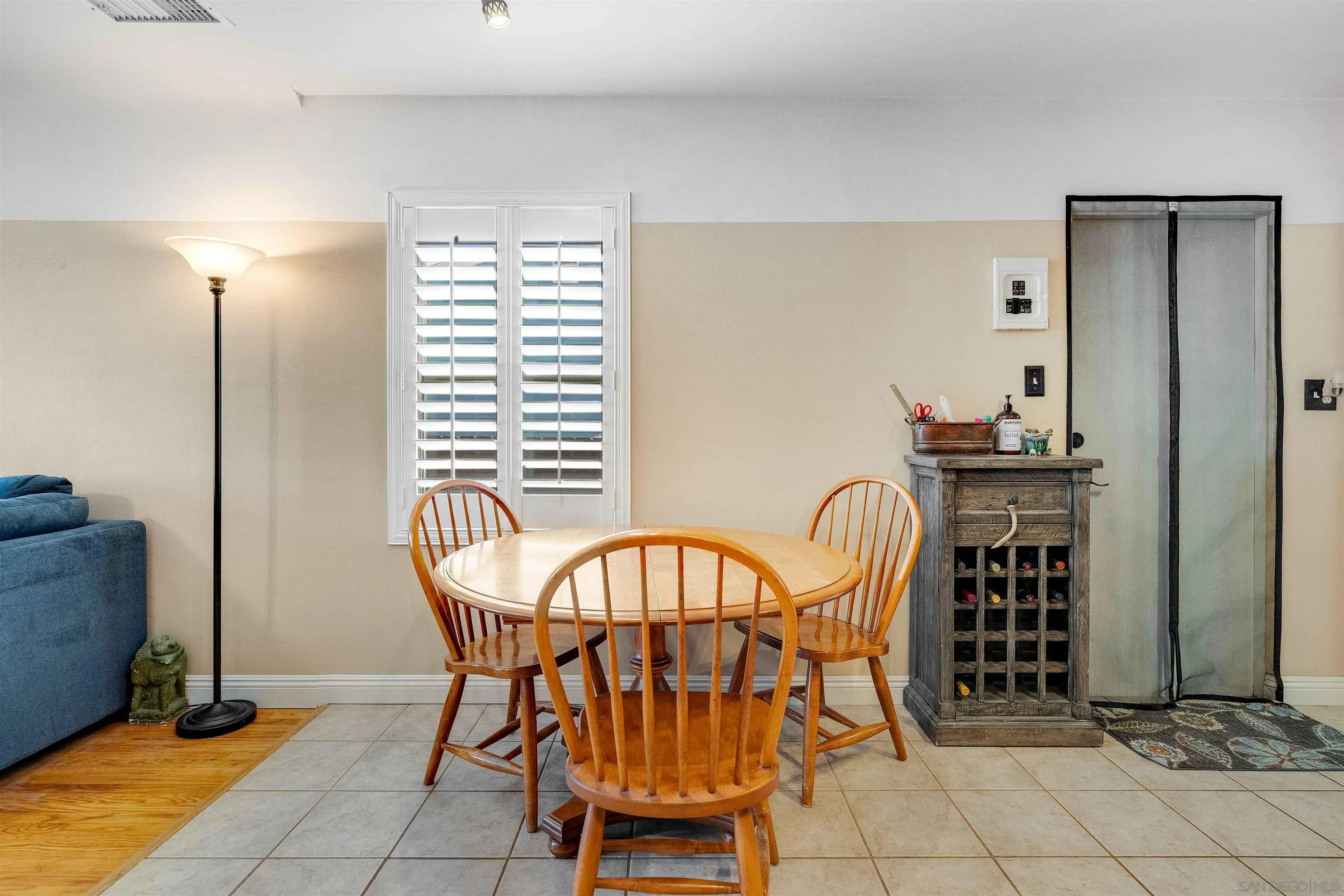4516 Olive Avenue La Mesa, CA 91942 - Photo 12 of 48 a view of a dining room with furniture and chandelier