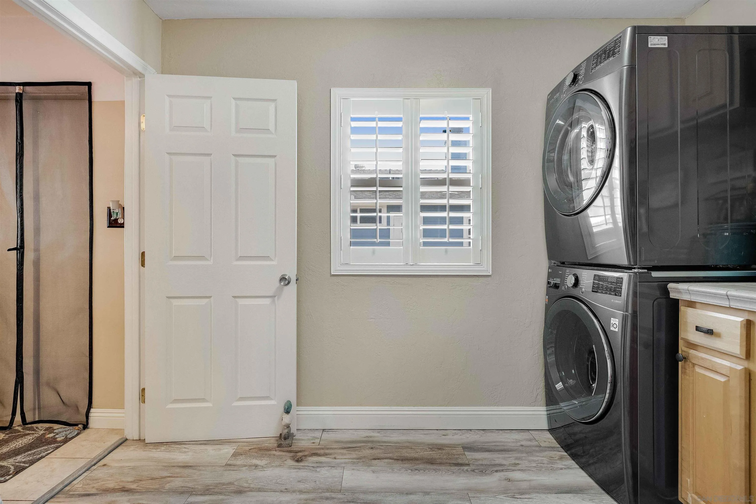 4516 Olive Avenue La Mesa, CA 91942 - Photo 13 of 48 a view of a hallway with washer and dryer