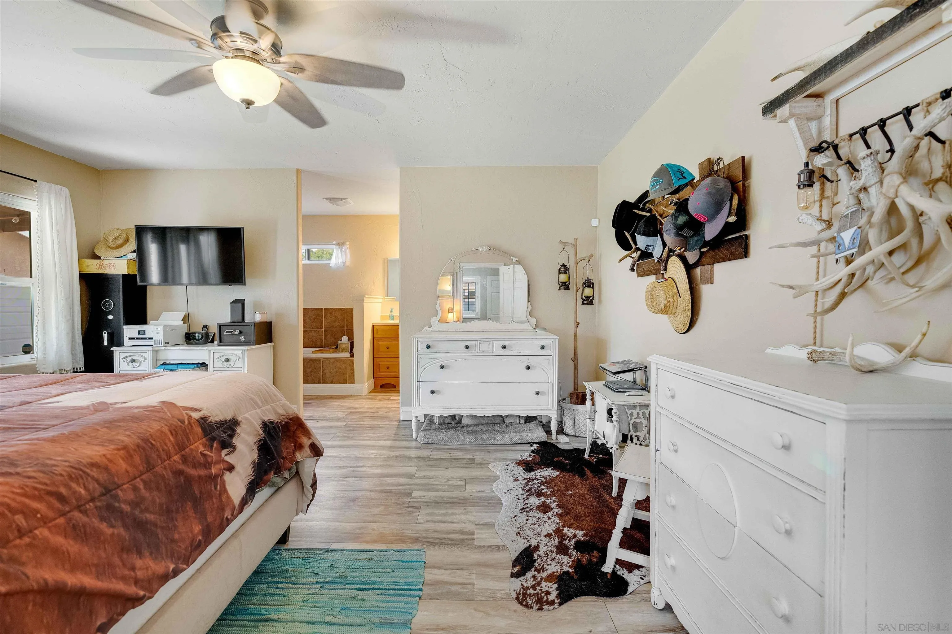 4516 Olive Avenue La Mesa, CA 91942 - Photo 15 of 48 a bedroom with bed and a chandelier