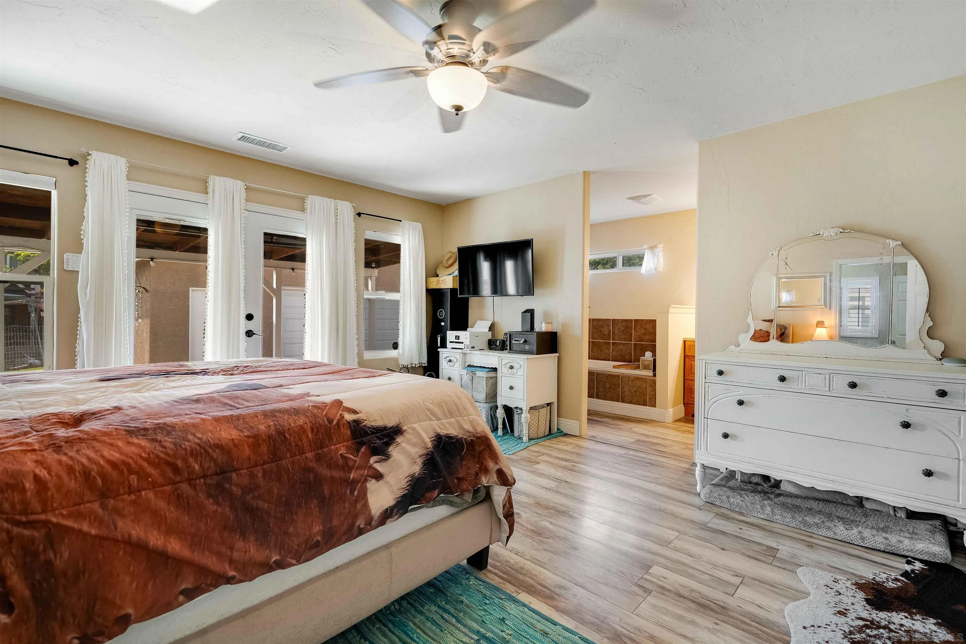 4516 Olive Avenue La Mesa, CA 91942 - Photo 16 of 48 a spacious bedroom with a bed and a dresser