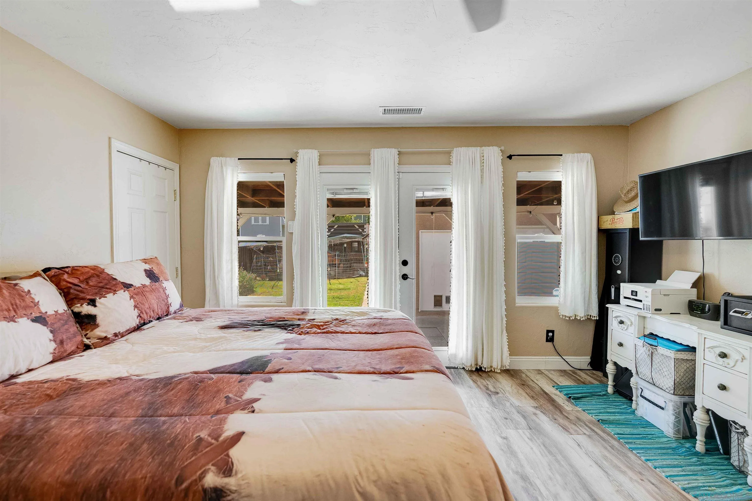 4516 Olive Avenue La Mesa, CA 91942 - Photo 18 of 48 a bedroom with a bed and large window