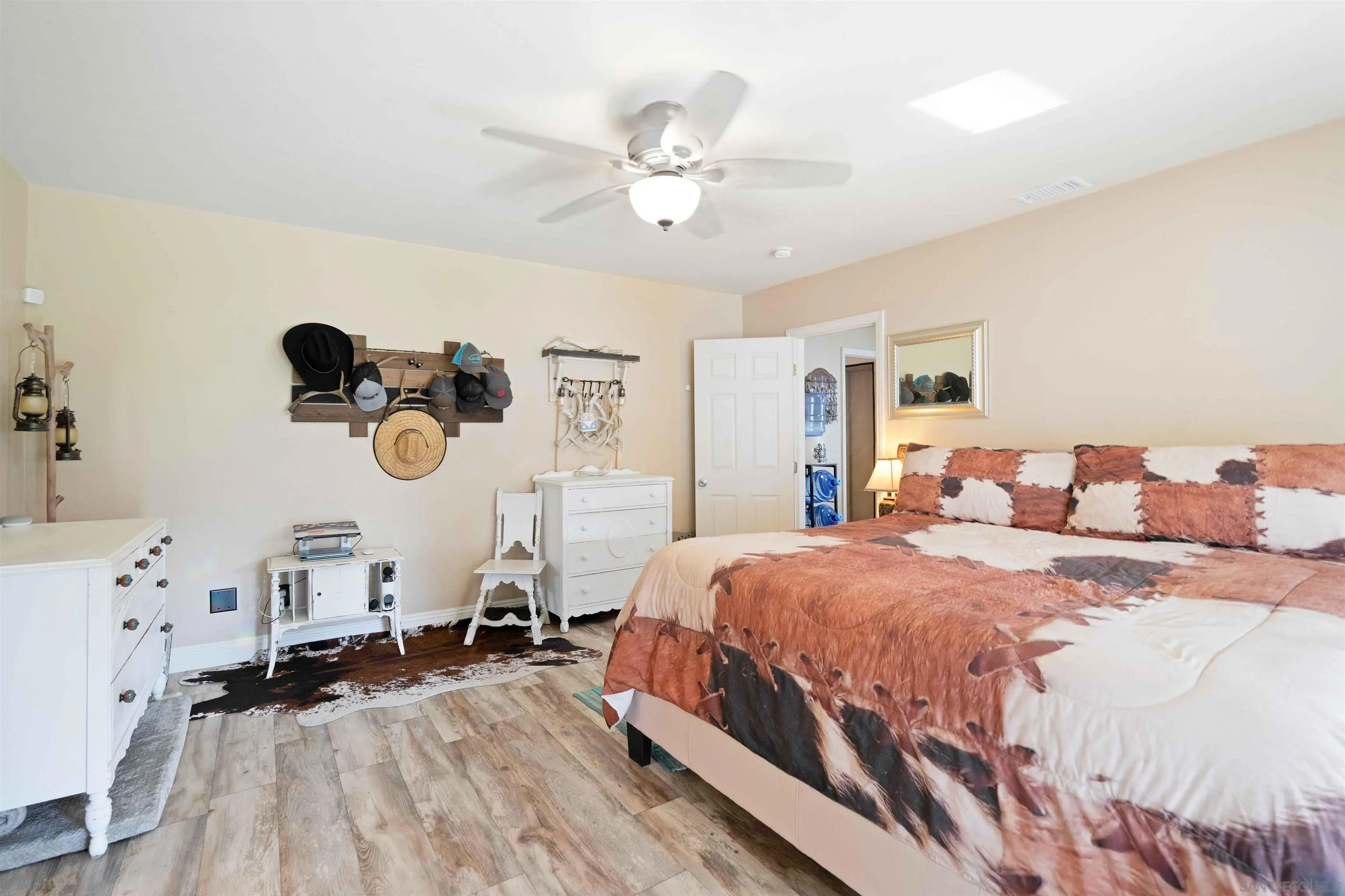 4516 Olive Avenue La Mesa, CA 91942 - Photo 19 of 48 a bedroom with a bed and wooden floor