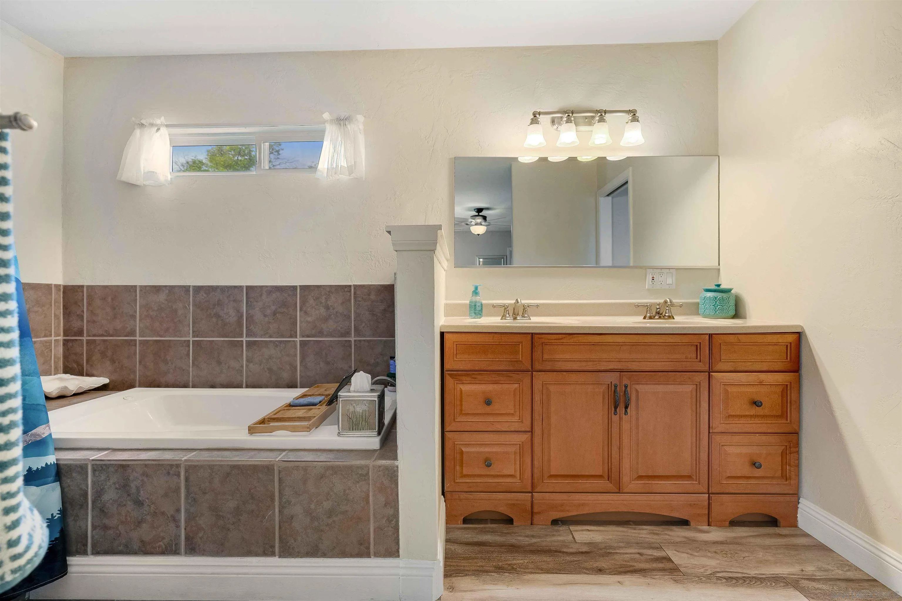 4516 Olive Avenue La Mesa, CA 91942 - Photo 20 of 48 a bathroom with a sink a vanity and mirror