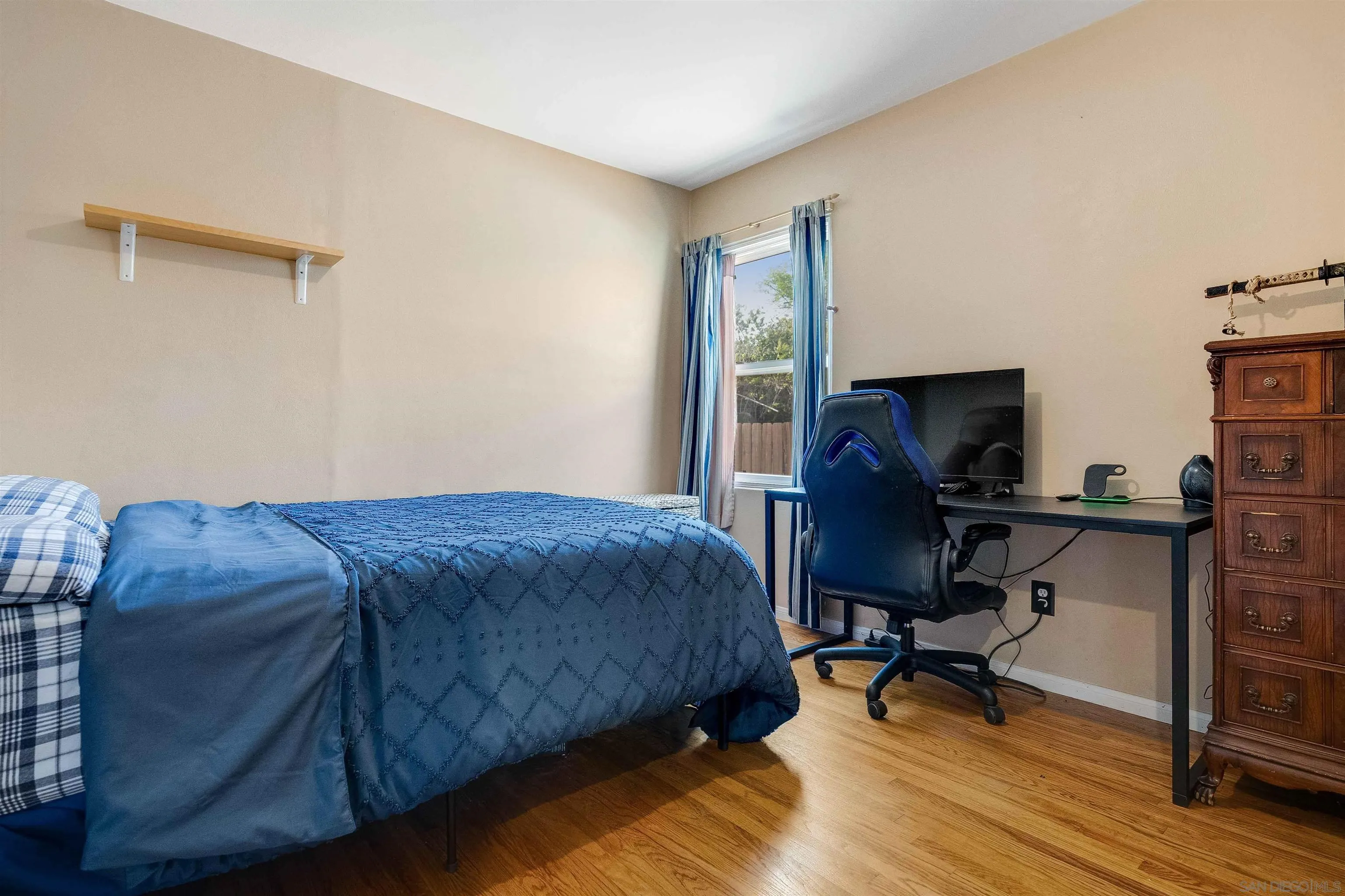 4516 Olive Avenue La Mesa, CA 91942 - Photo 32 of 48 a bedroom with a bed and a desk