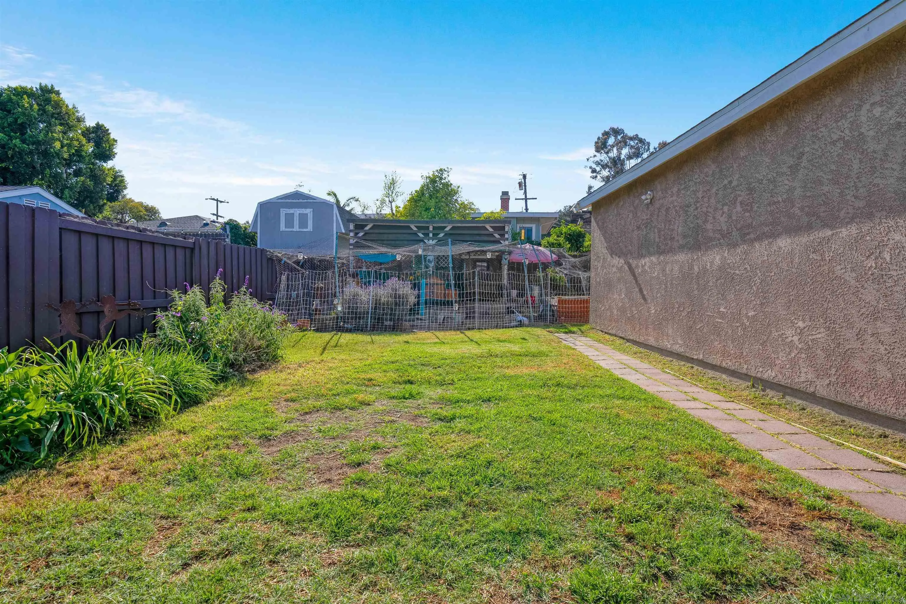 4516 Olive Avenue La Mesa, CA 91942 - Photo 38 of 48 a view of a backyard with a small pool and plants