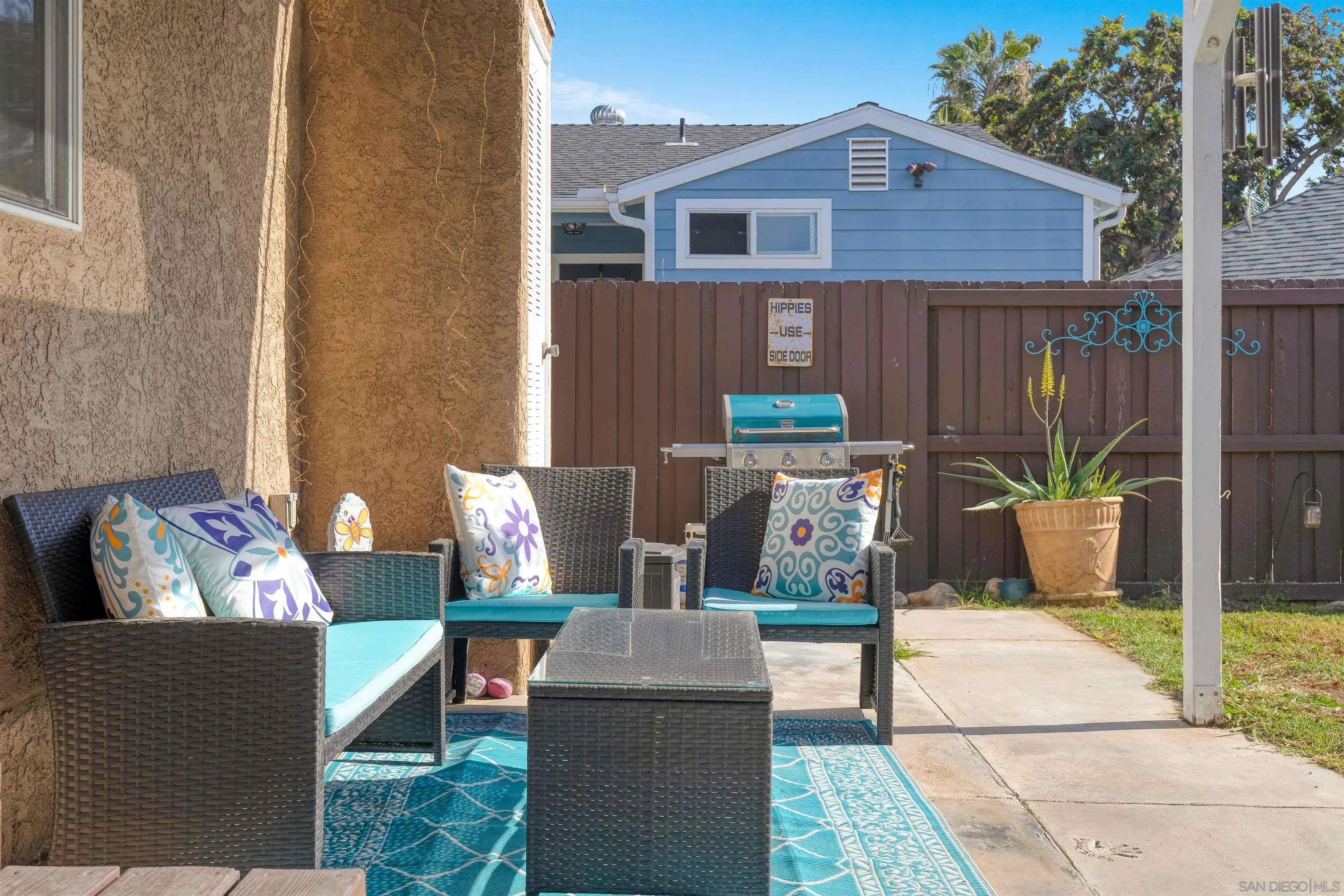 4516 Olive Avenue La Mesa, CA 91942 - Photo 40 of 48 a view of a patio with couches chairs and a fire pit