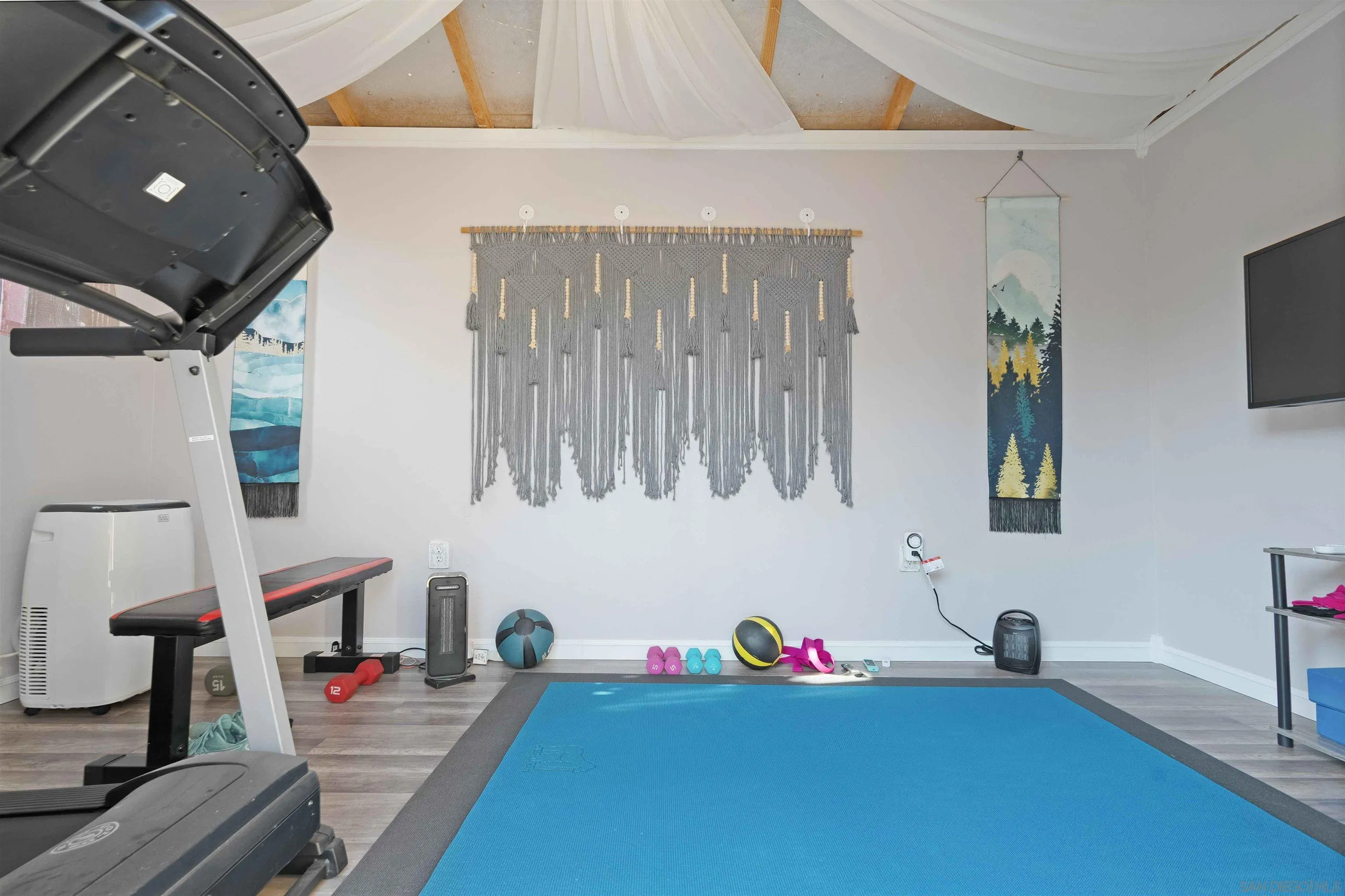 4516 Olive Avenue La Mesa, CA 91942 - Photo 46 of 48 a living room with furniture and a flat screen tv