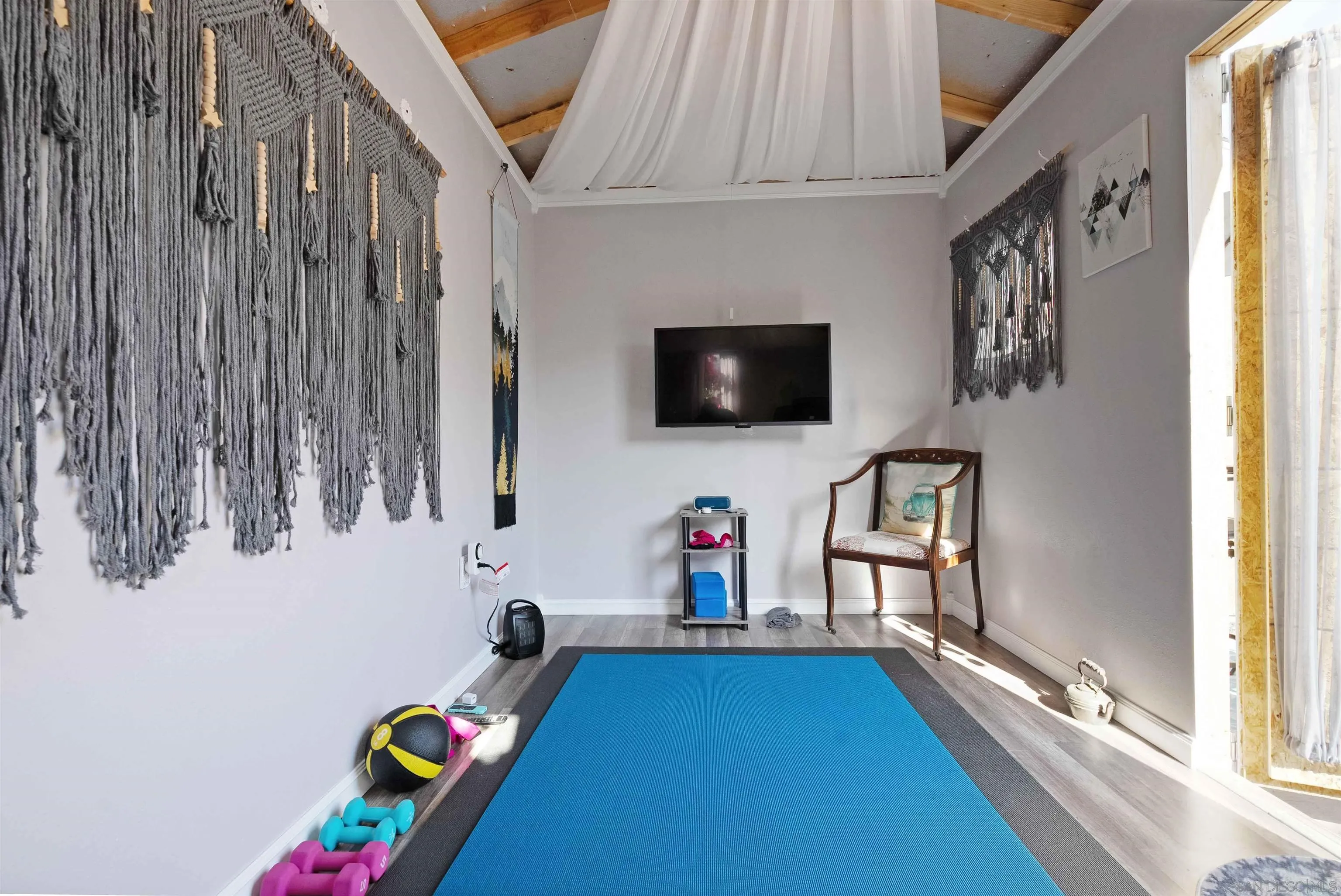 4516 Olive Avenue La Mesa, CA 91942 - Photo 47 of 48 a playing room with furniture and a flat screen tv