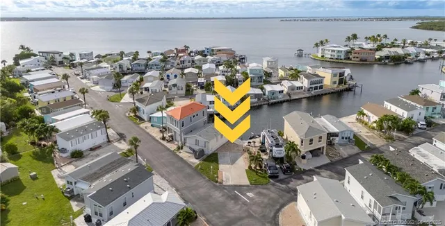 an aerial view of a house with a lake view