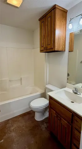 a bathroom with a sink a toilet and bathtub