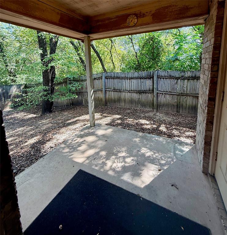 954 East 3rd Street Weatherford, TX 76086 - Photo 14 of 17 a view of a yard with a large trees