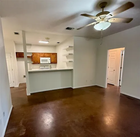 a view of a kitchen with a sink and cabinet area
