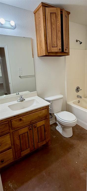 954 East 3rd Street Weatherford, TX 76086 - Photo 10 of 17 a bathroom with a sink a toilet and a mirror