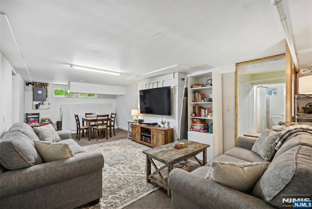 57 Oldis Street Rochelle Park, NJ 07662 - Photo 14 of 19 a living room with furniture and a flat screen tv