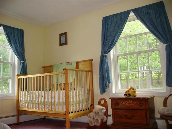 8 Browns Brook Road Webster, MA 01570 - Photo 12 of 20 a view of a bedroom with furniture and windows