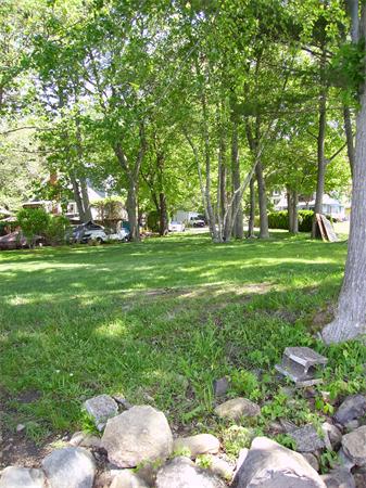 8 Browns Brook Road Webster, MA 01570 - Photo 18 of 20 a backyard of a house with table and chairs