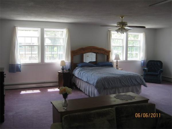 8 Browns Brook Road Webster, MA 01570 - Photo 7 of 20 a bedroom with a bed and window