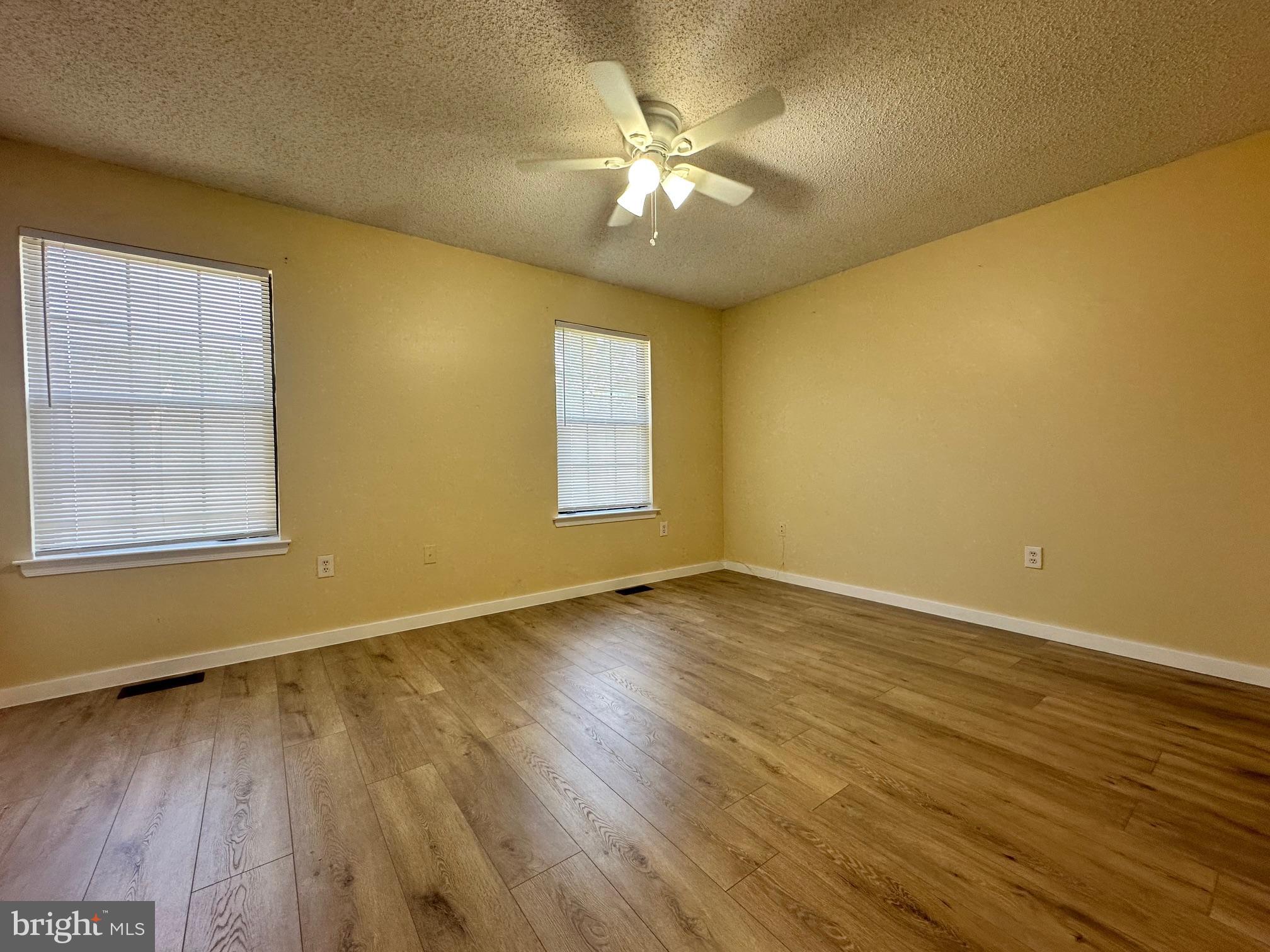 6 Wosniak Court Lawrence Township, NJ 08648 - Photo 14 of 20 a view of an empty room with wooden floor and a window