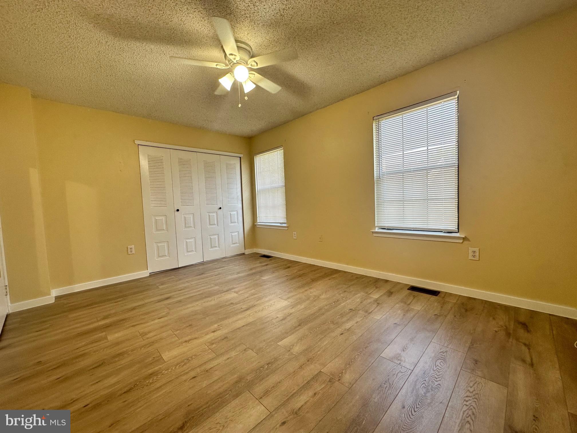 6 Wosniak Court Lawrence Township, NJ 08648 - Photo 15 of 20 a view of an empty room with wooden floor and a window