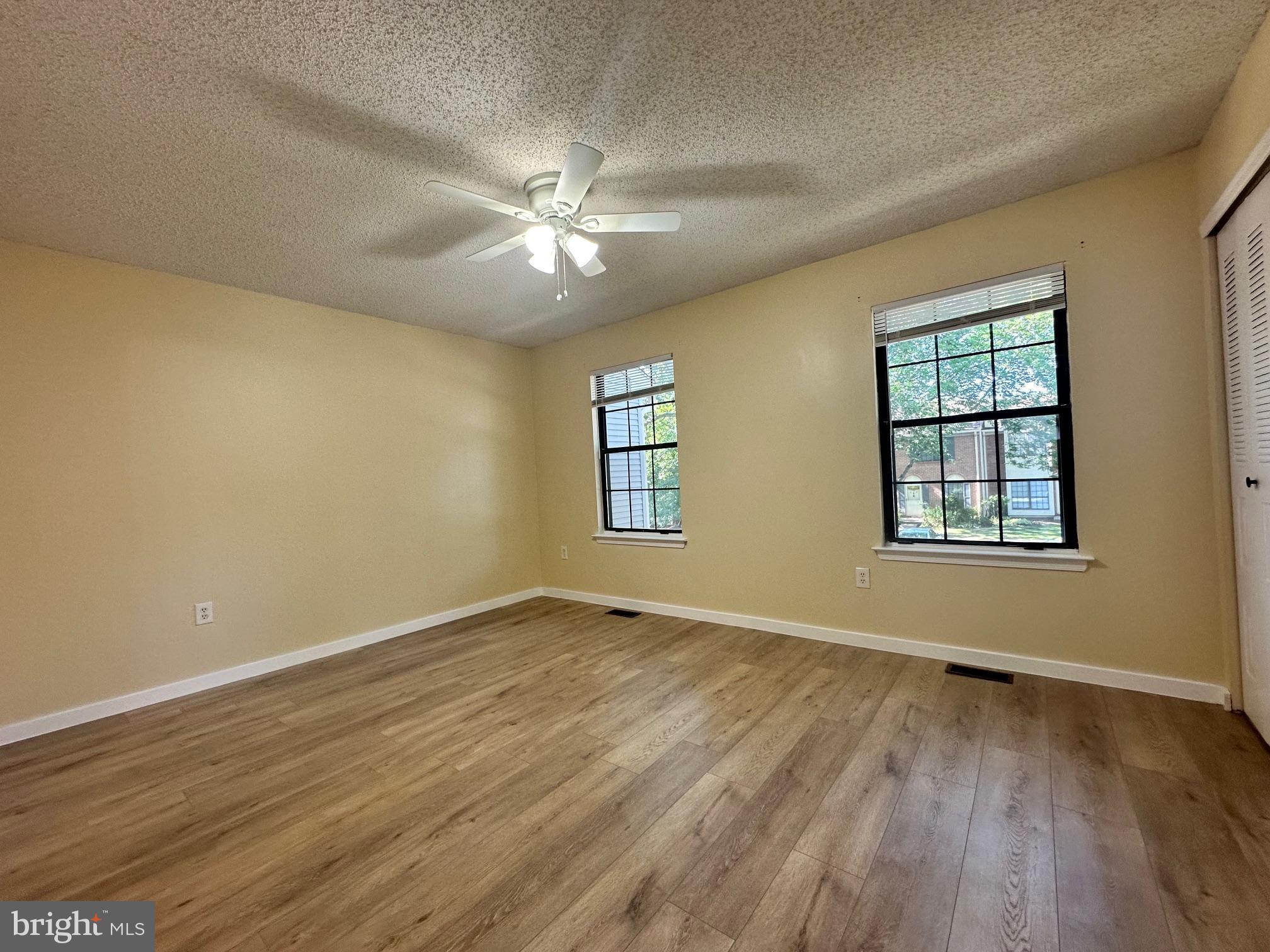 6 Wosniak Court Lawrence Township, NJ 08648 - Photo 16 of 20 a view of an empty room with wooden floor and a window