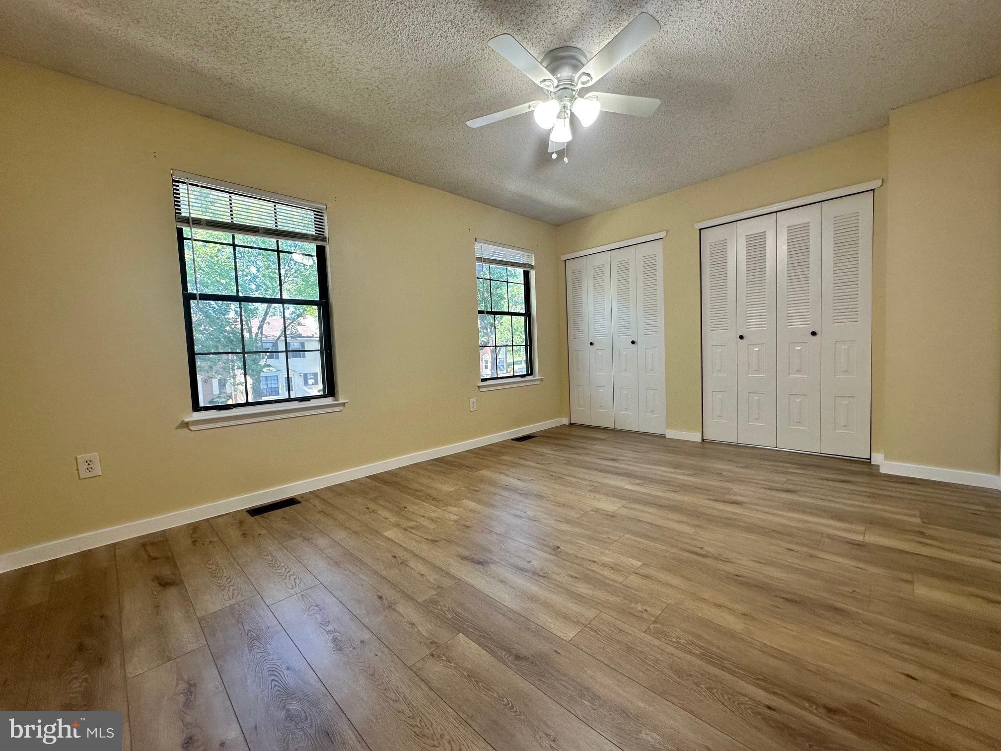 6 Wosniak Court Lawrence Township, NJ 08648 - Photo 17 of 20 a view of an empty room with a window and wooden floor