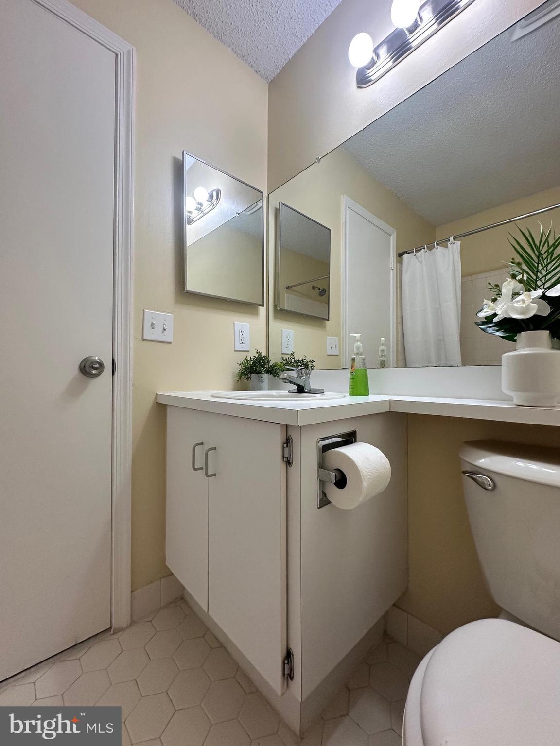 6 Wosniak Court Lawrence Township, NJ 08648 - Photo 20 of 20 a bathroom with a granite countertop toilet sink and mirror