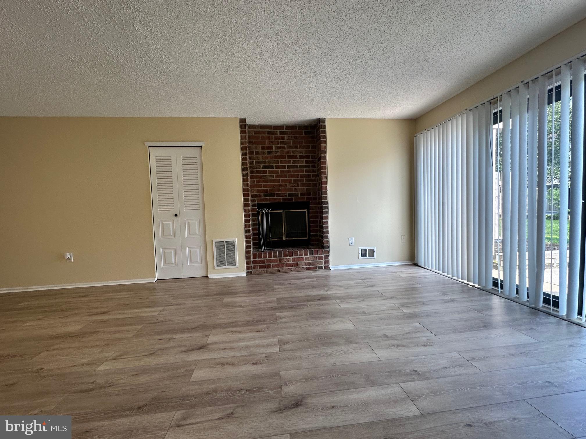 6 Wosniak Court Lawrence Township, NJ 08648 - Photo 7 of 20 an empty room with windows and a fireplace
