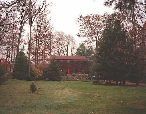 69 Mather Road Stamford, CT 06903 - Photo 1 of 1 a front view of a house with a yard