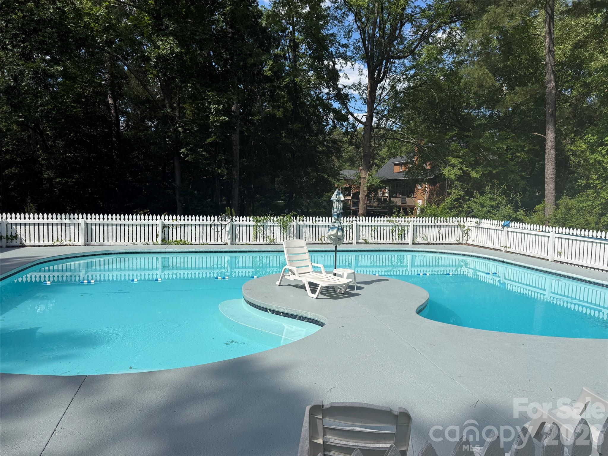 209 Fairway Road Cheraw, SC 29520 - Photo 46 of 48 a view of a swimming pool with a yard