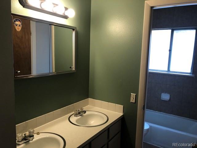 2703 Stanford Road Fort Collins, CO 80525 - Photo 13 of 30 a bathroom with a sink and a mirror