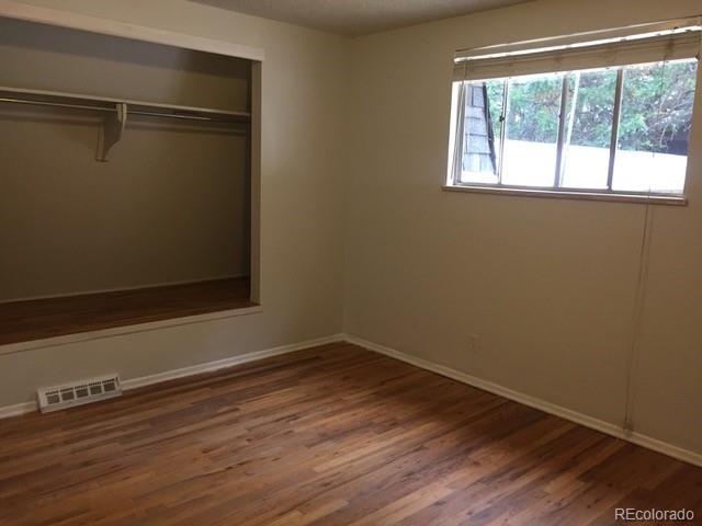 2703 Stanford Road Fort Collins, CO 80525 - Photo 20 of 30 a view of a room with wooden floor and small window
