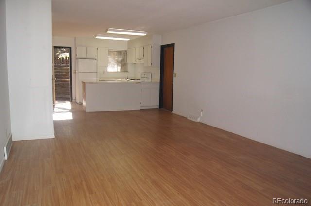 2703 Stanford Road Fort Collins, CO 80525 - Photo 24 of 30 a view of a kitchen cabinets and wooden floor