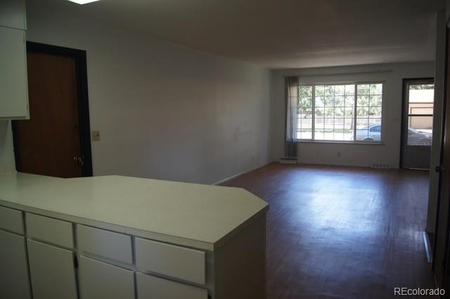 2703 Stanford Road Fort Collins, CO 80525 - Photo 30 of 30 an empty room with wooden floor and windows