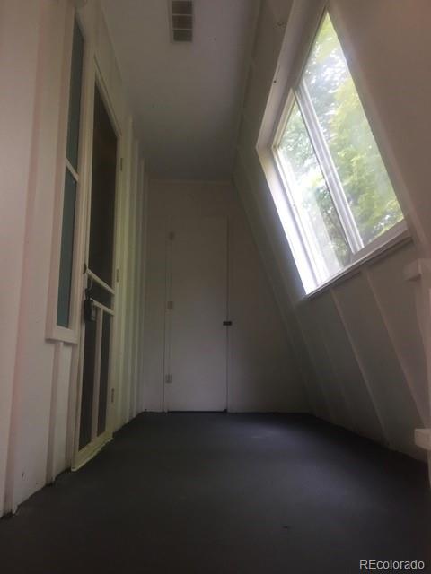 2703 Stanford Road Fort Collins, CO 80525 - Photo 4 of 30 an empty room with windows