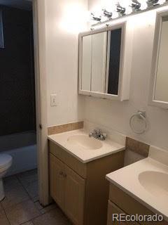 2703 Stanford Road Fort Collins, CO 80525 - Photo 9 of 30 a bathroom with a sink toilet and tub