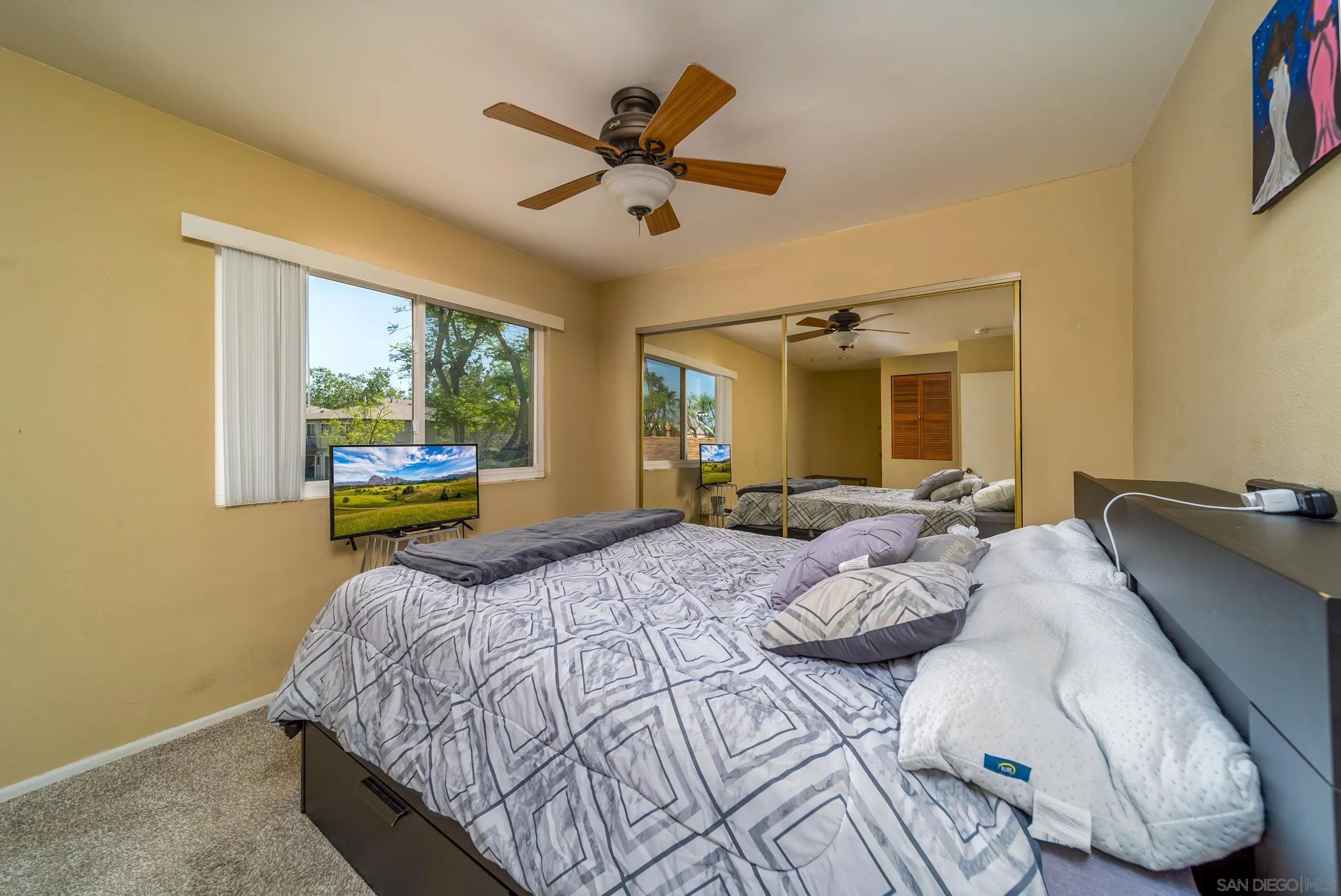9920 Mission Vega Road, Unit 2 Santee, CA 92071 - Photo 11 of 21 a bedroom with a bed and window