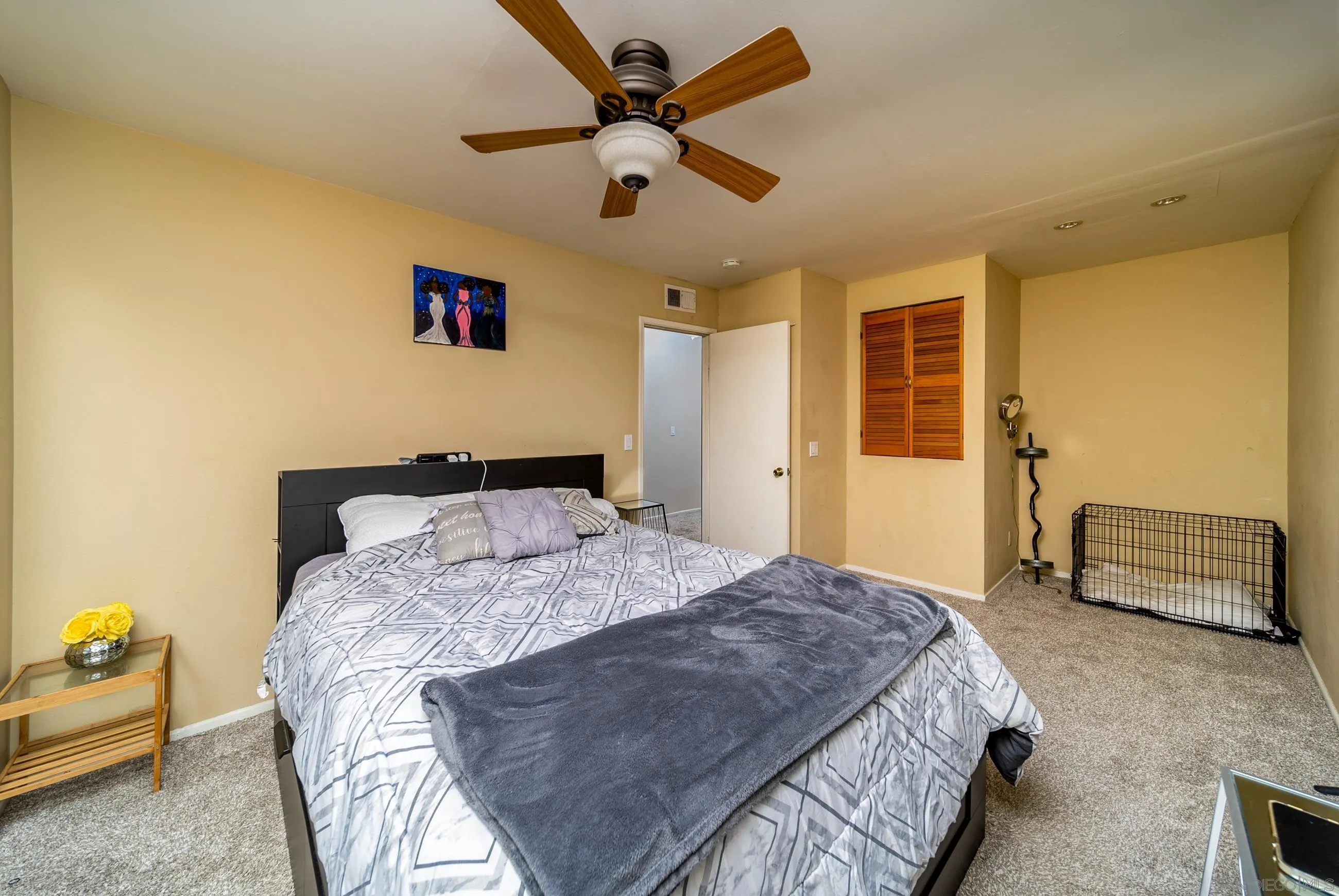 9920 Mission Vega Road, Unit 2 Santee, CA 92071 - Photo 12 of 21 a bedroom with a bed and a chandelier