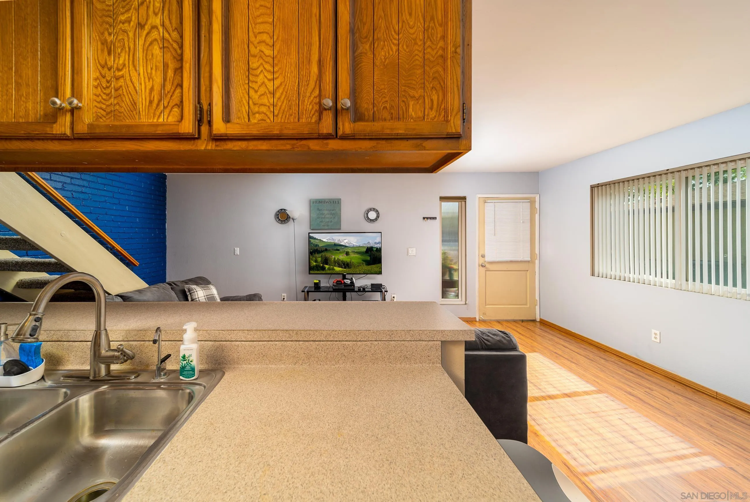 9920 Mission Vega Road, Unit 2 Santee, CA 92071 - Photo 15 of 21 a kitchen with stainless steel appliances kitchen island granite countertop a sink and cabinets