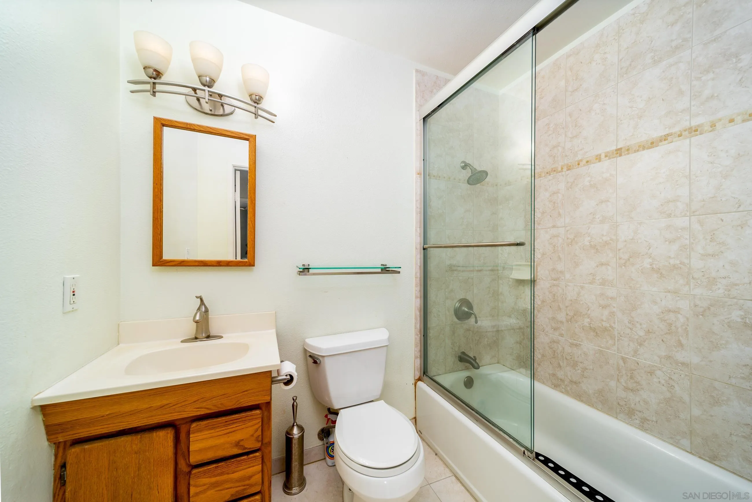 9920 Mission Vega Road, Unit 2 Santee, CA 92071 - Photo 5 of 21 a bathroom with a sink a toilet and shower