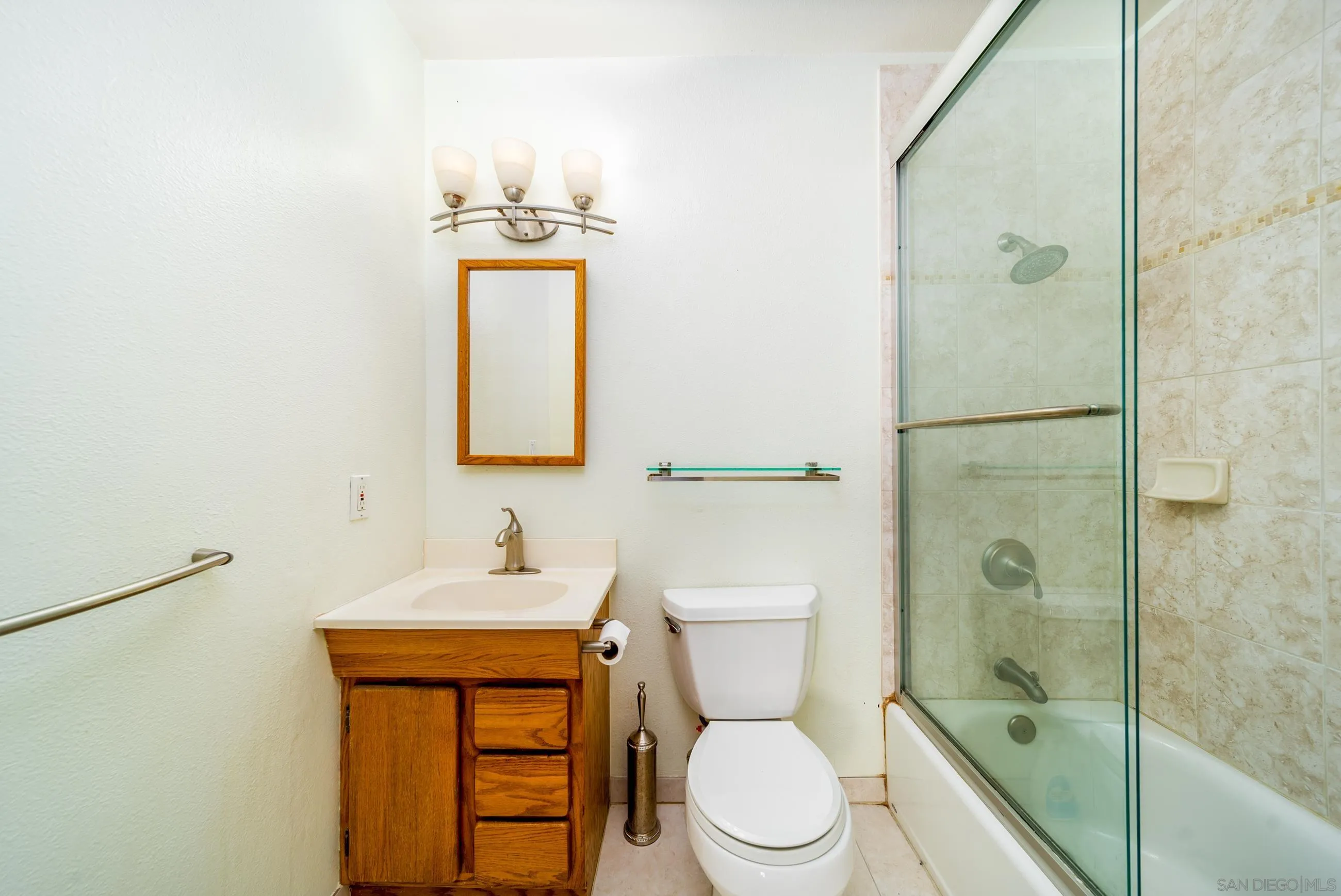 9920 Mission Vega Road, Unit 2 Santee, CA 92071 - Photo 6 of 21 a bathroom with a toilet sink shower and mirror