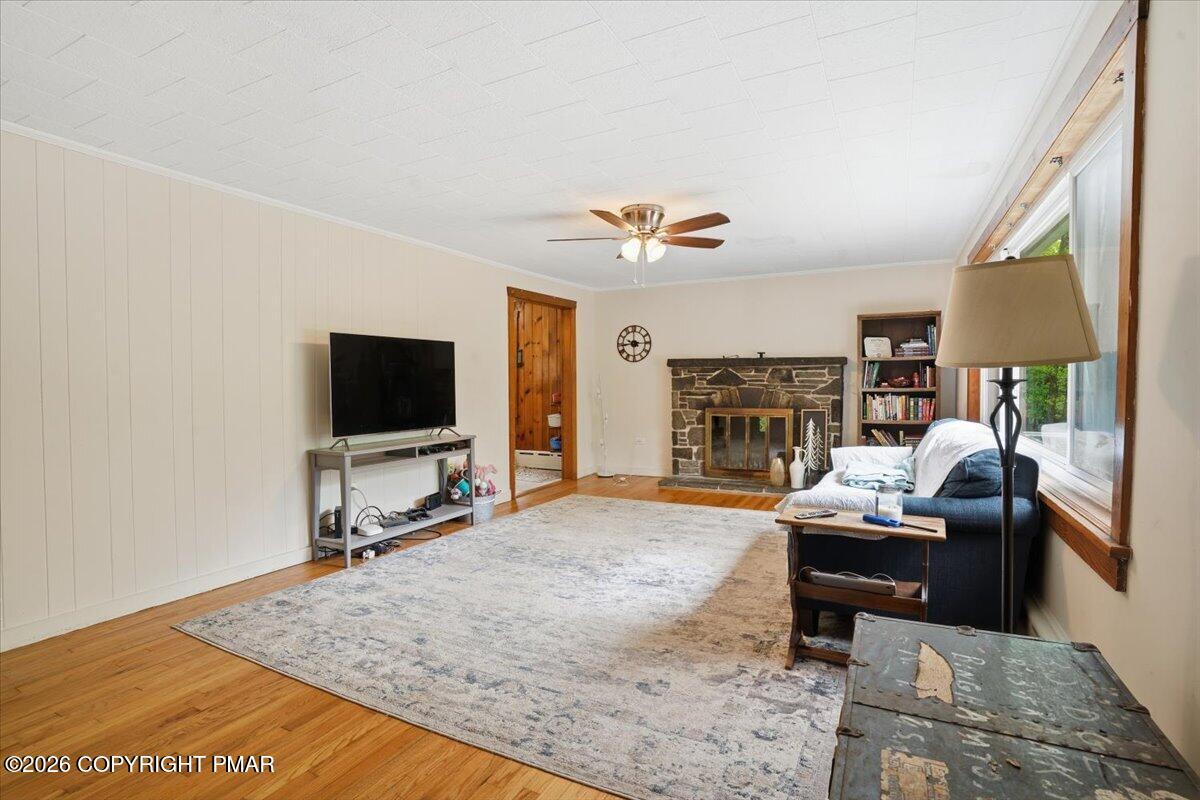 232 Garrity Road Hawley, PA 18428 - Photo 18 of 57 a living room with fireplace furniture and a flat screen tv