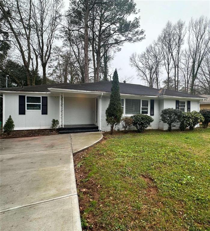 2945 Belvedere Lane Decatur, GA 30032 - Photo 1 of 1 a front view of a house with garden