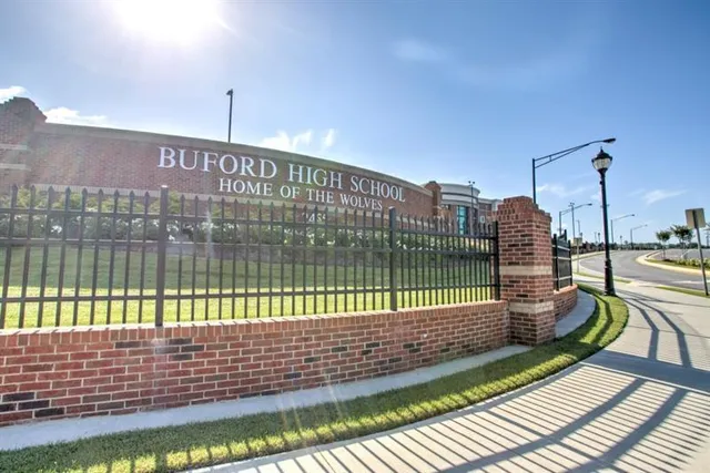 a view of a balcony with a floor to ceiling window next to a lake